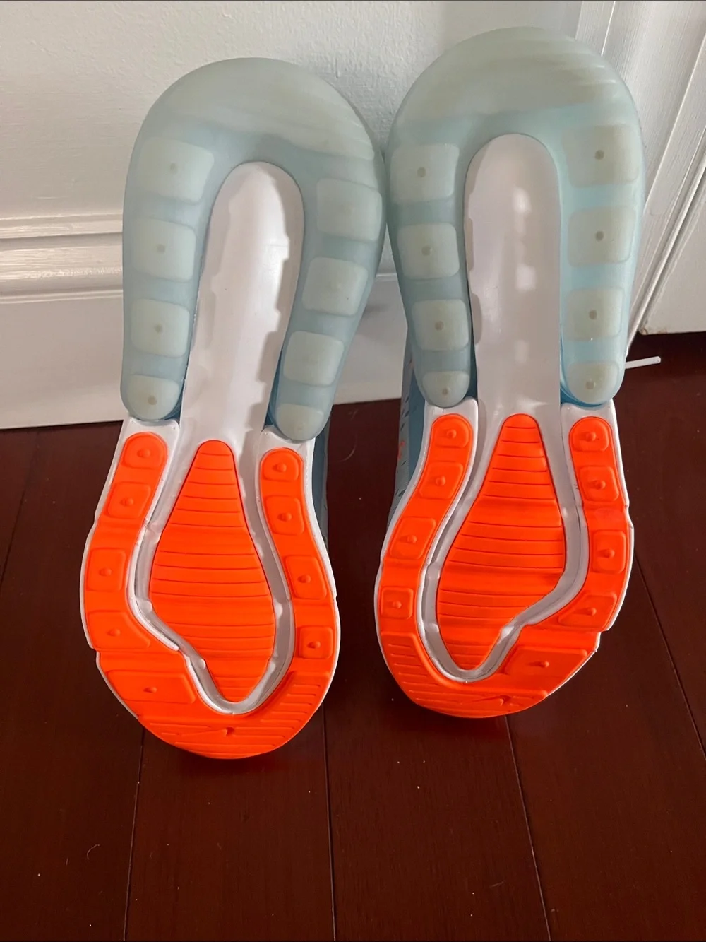 Nike Women’s Light Blue Sneakers with Orange Accents